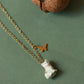Tiny white cat necklace in a walnut box