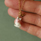 Tiny white cat necklace in a walnut box