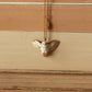Barn owl necklace with a feather charm