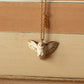 Barn owl necklace with a feather charm