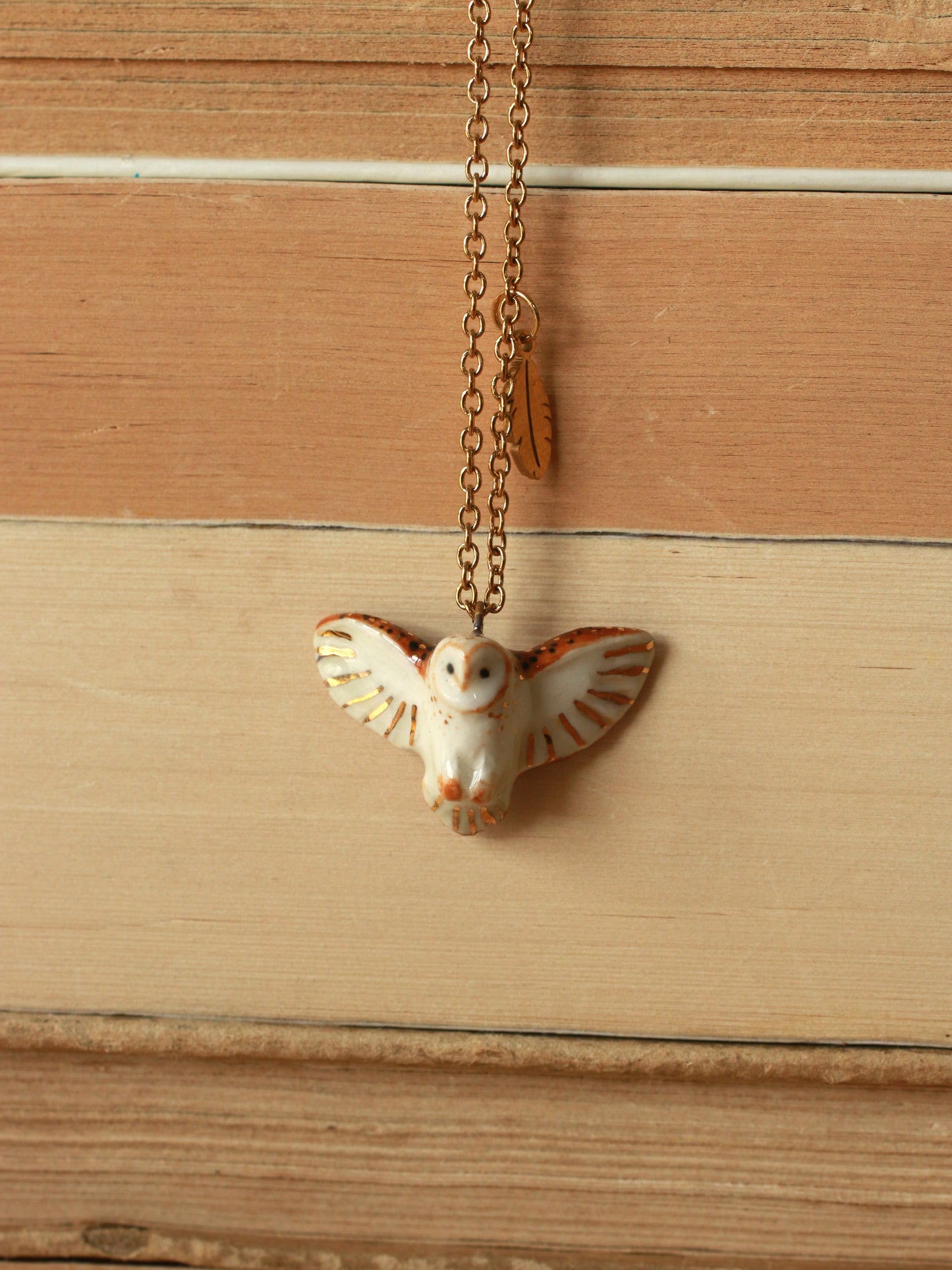 Barn owl necklace with a feather charm