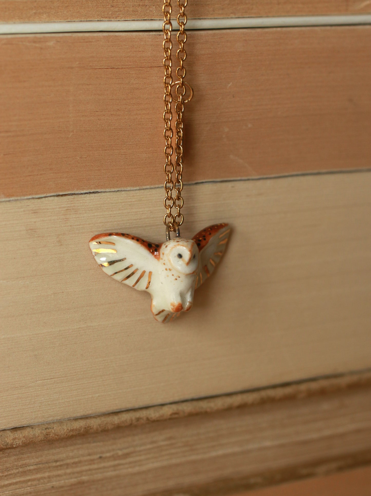 Barn owl necklace with a feather charm