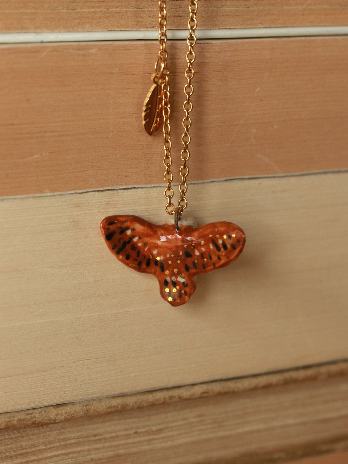 Barn owl necklace with a feather charm