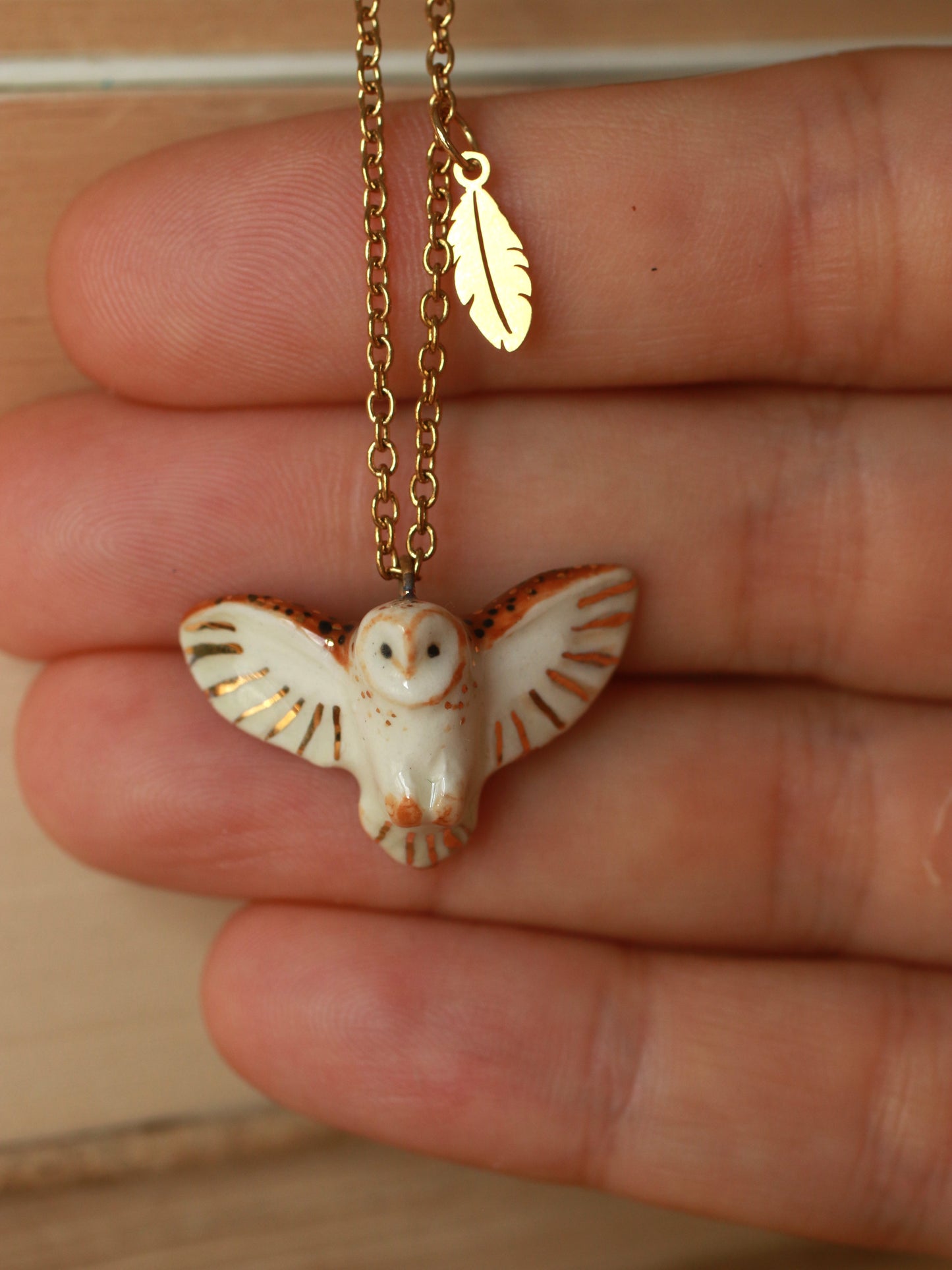 Barn owl necklace with a feather charm
