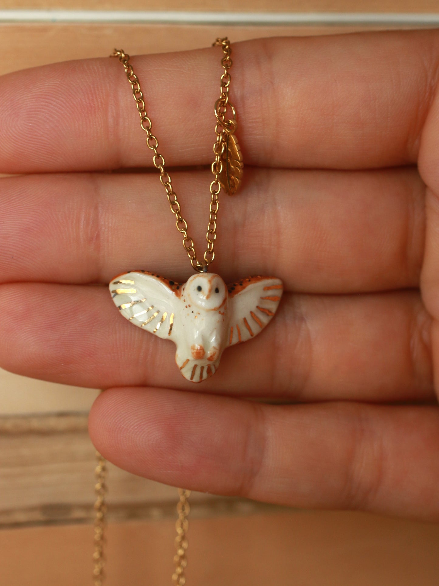 Barn owl necklace with a feather charm