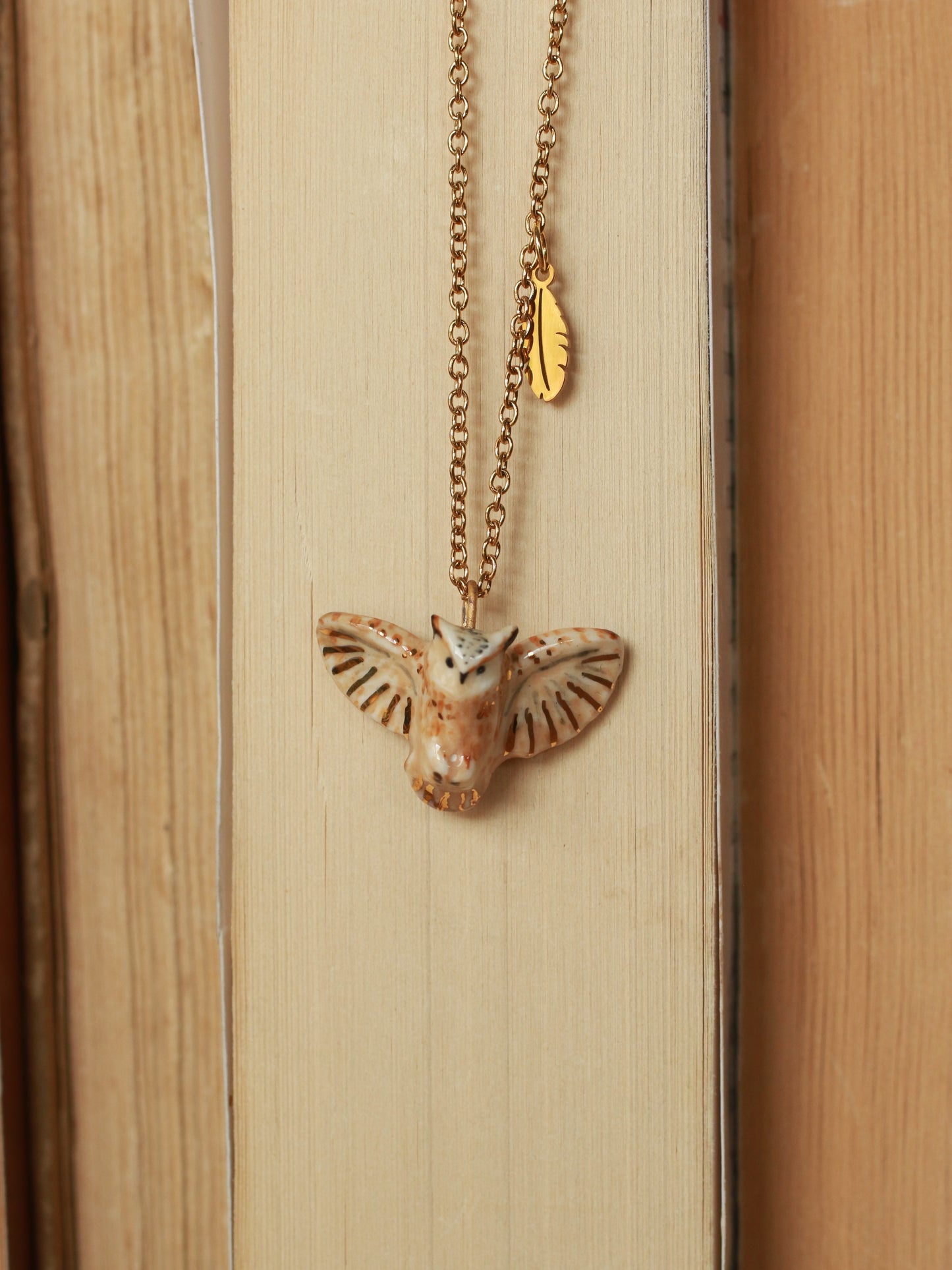 Eagle owl necklace with a feather charm