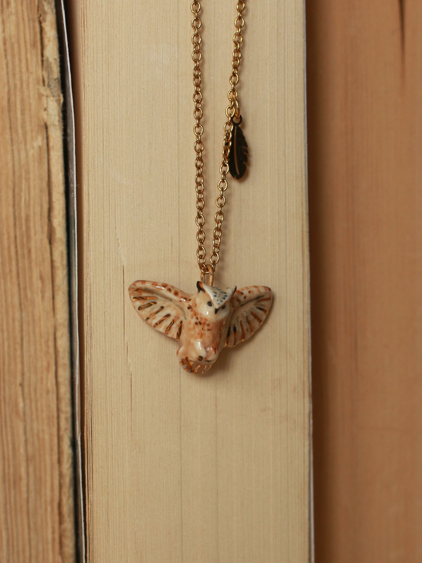 Eagle owl necklace with a feather charm