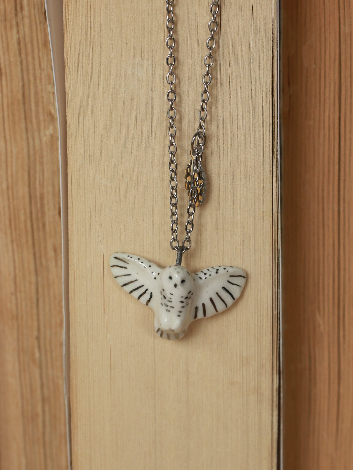 Snowy owl necklace with a feather charm