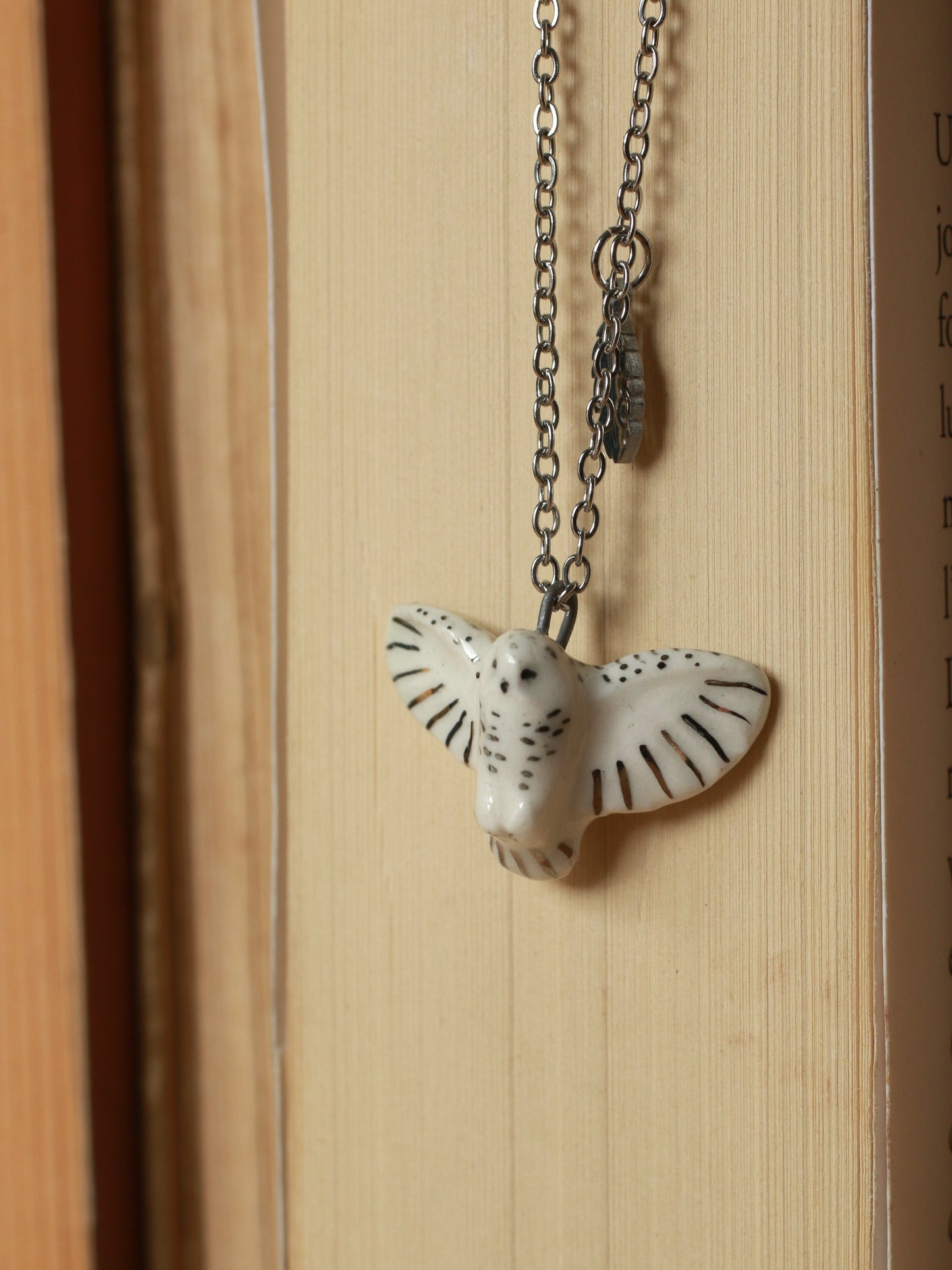 Snowy owl necklace with a feather charm