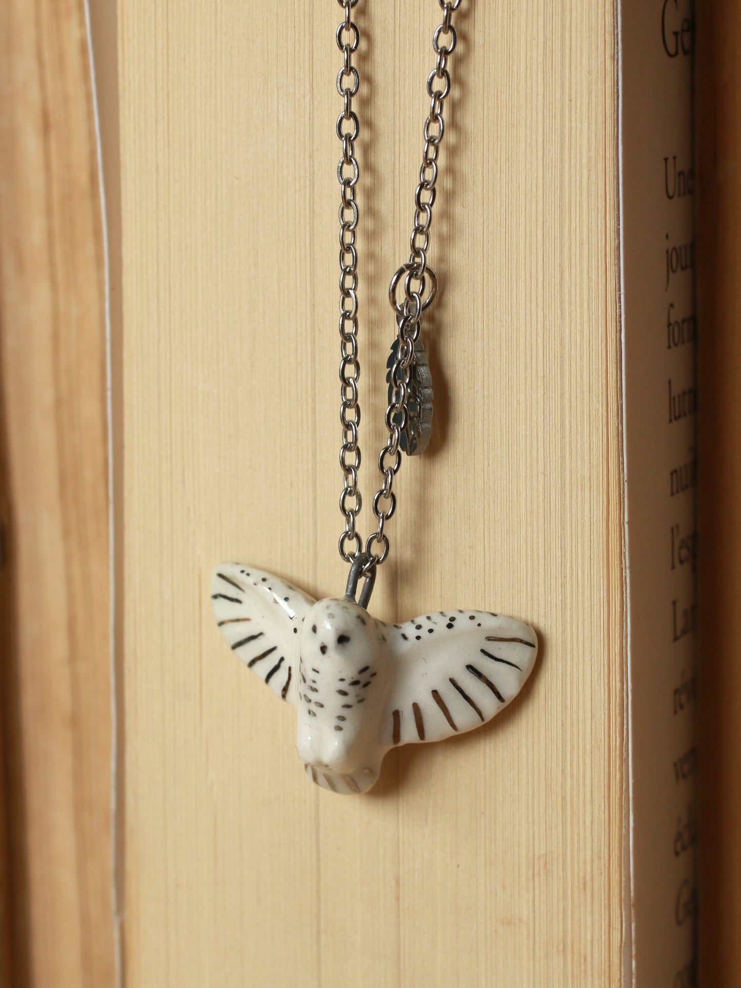Snowy owl necklace with a feather charm