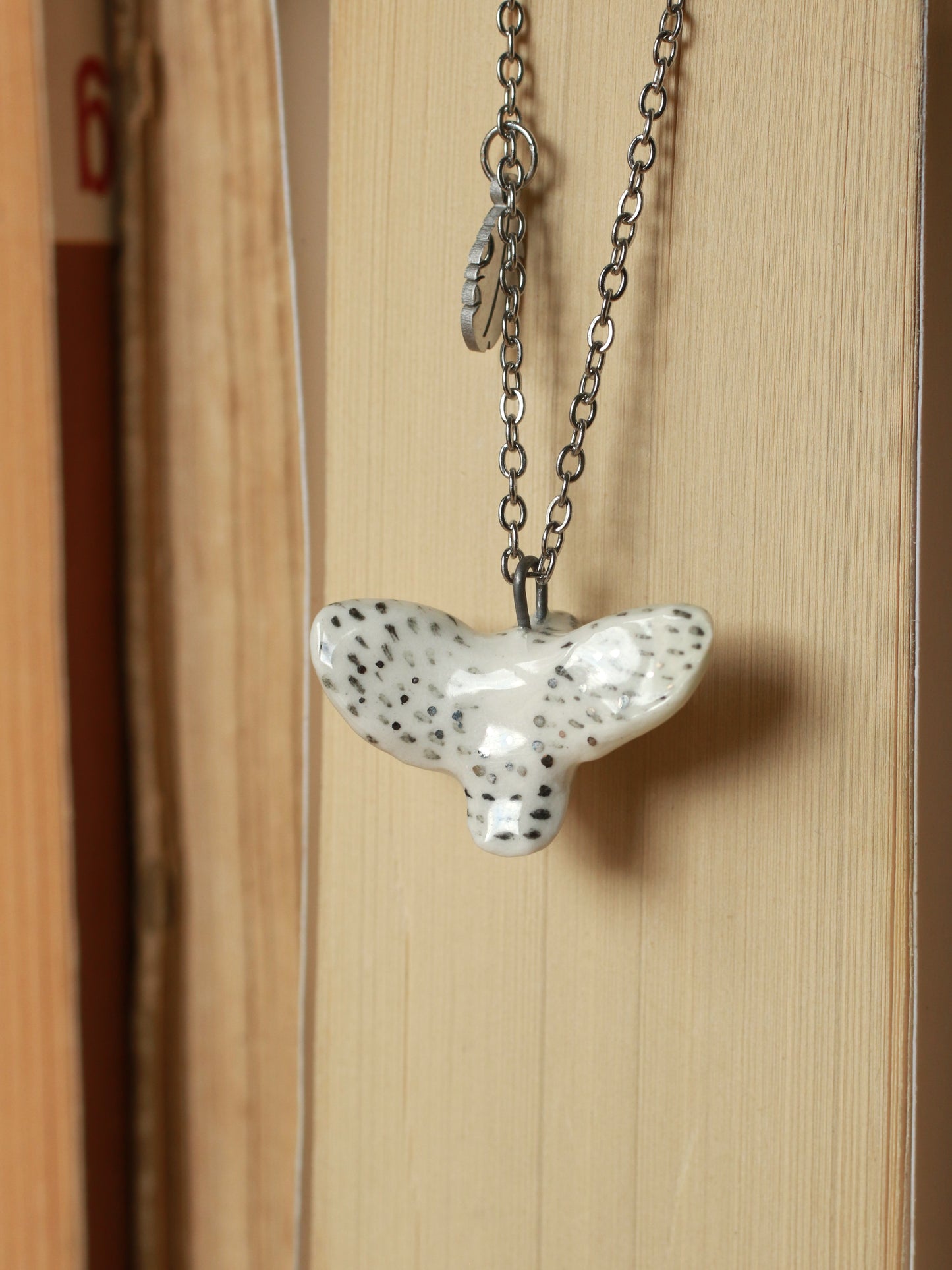 Snowy owl necklace with a feather charm