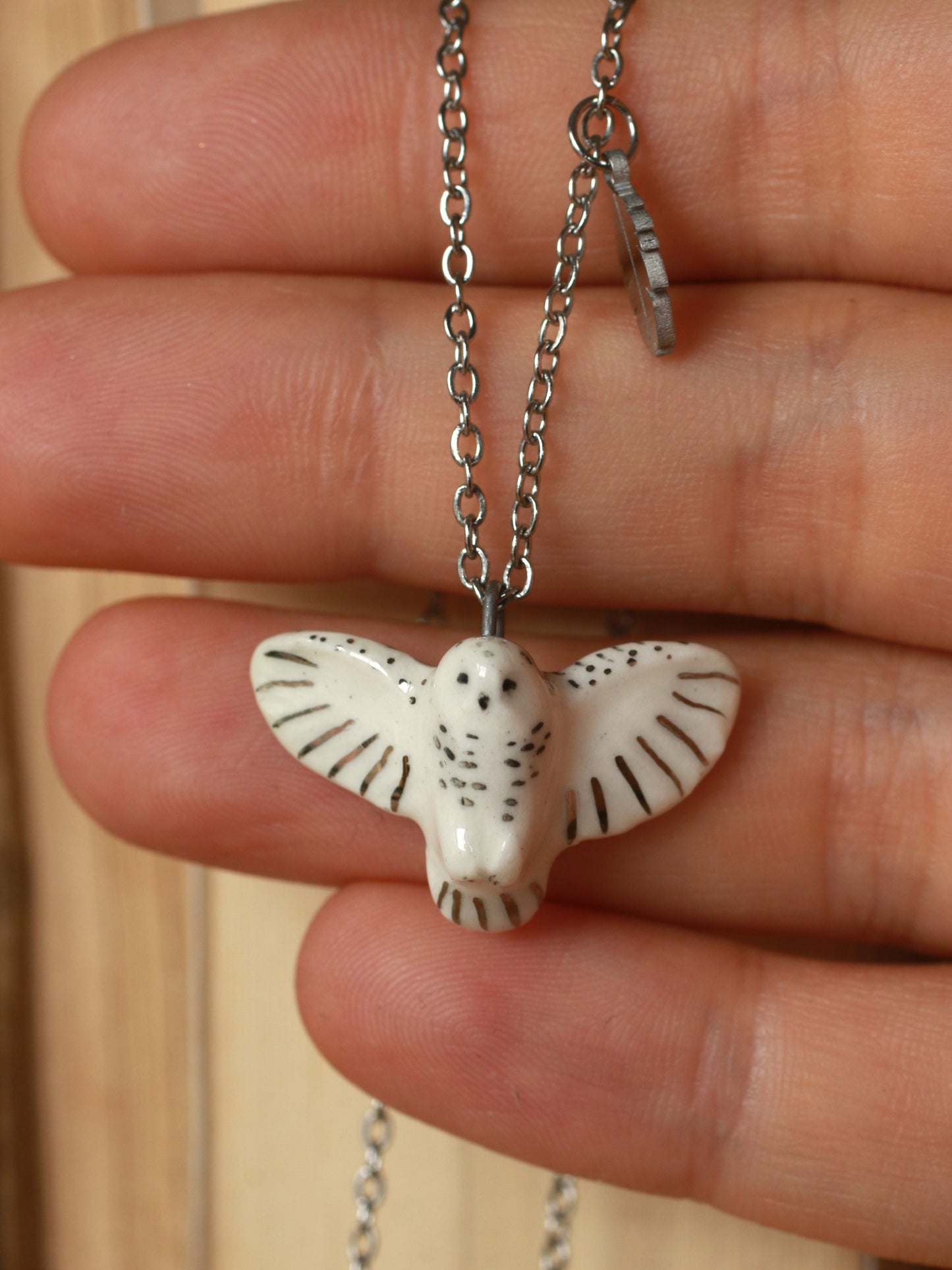 Snowy owl necklace with a feather charm