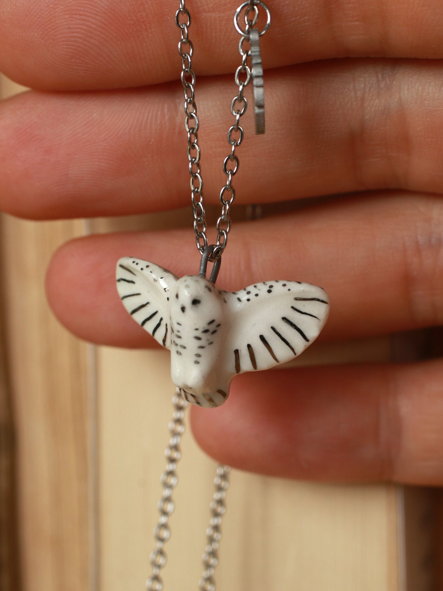 Snowy owl necklace with a feather charm