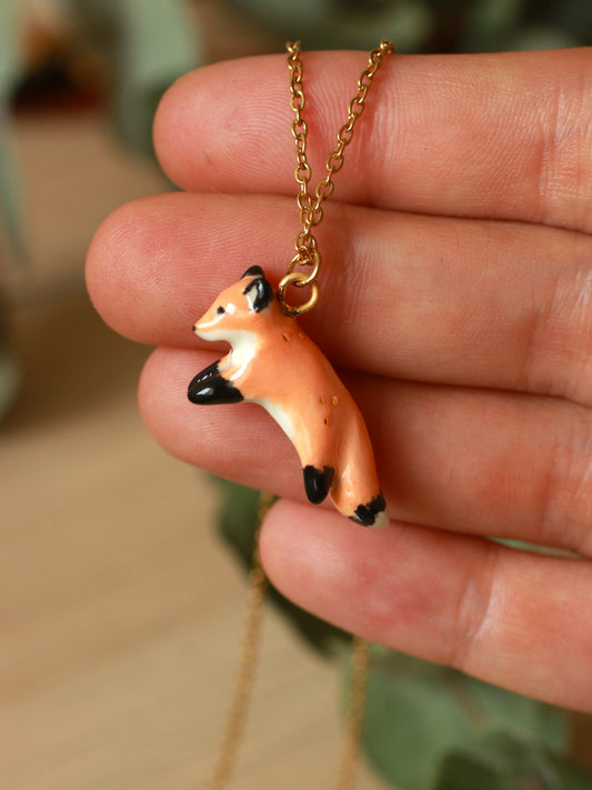 Ceramic jumping fox necklace - 22k gold details