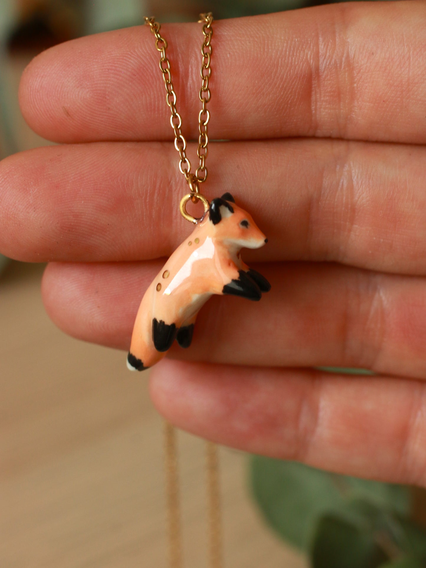 Ceramic jumping fox necklace - 22k gold details