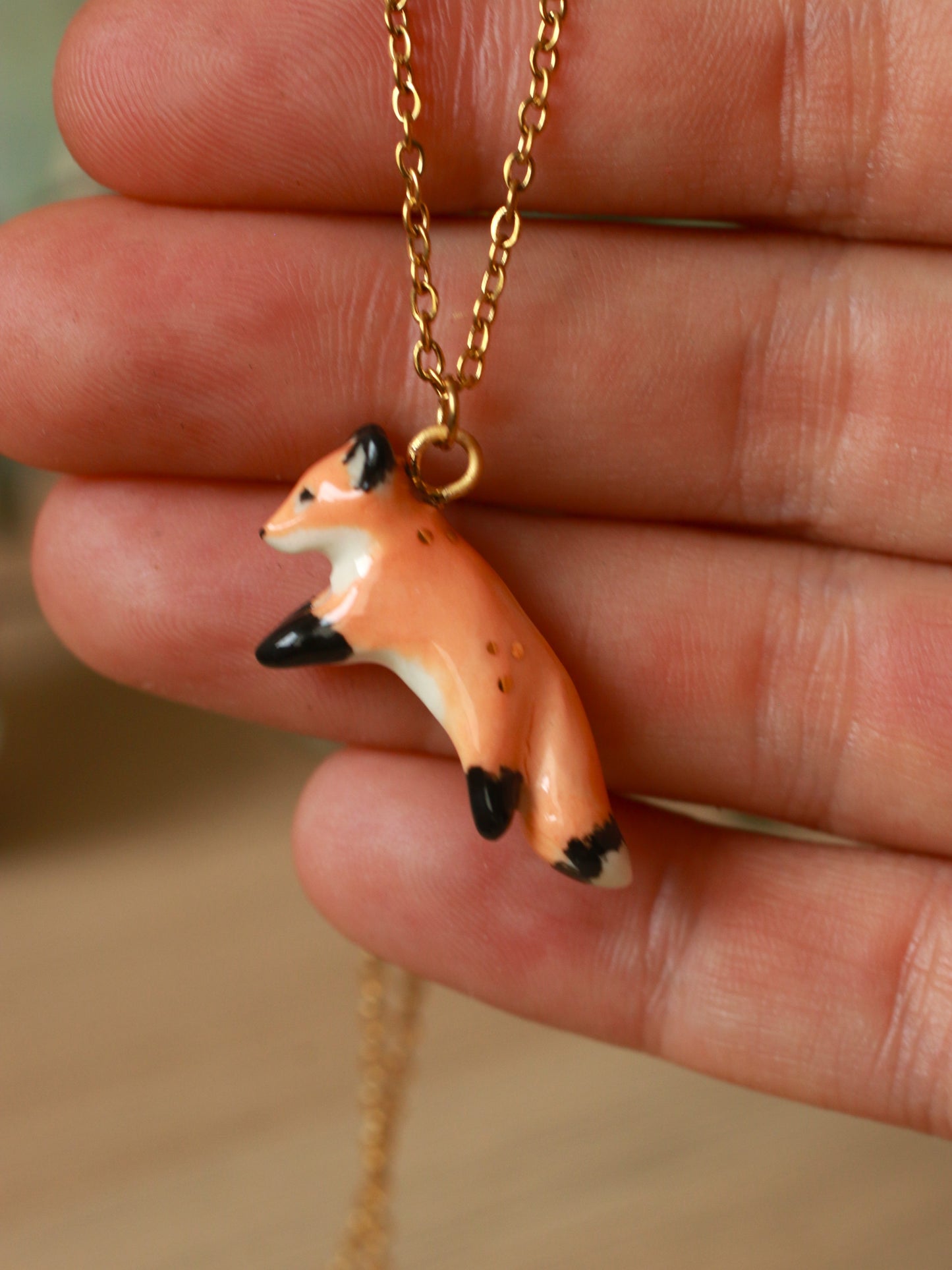 Ceramic jumping fox necklace - 22k gold details