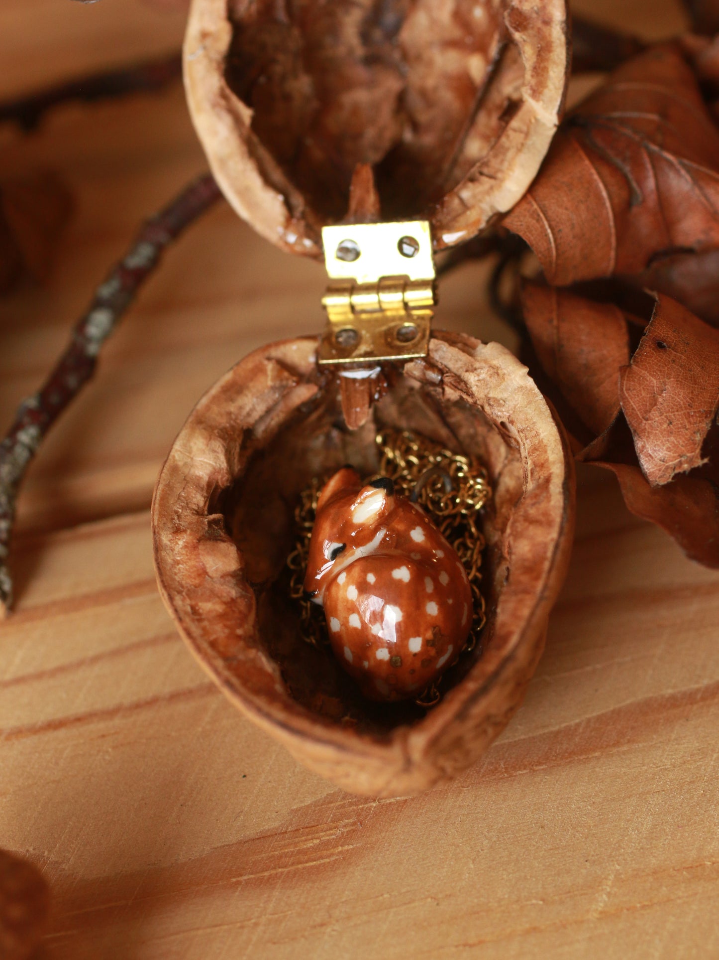 Sleeping Fawn necklace in a walnut box
