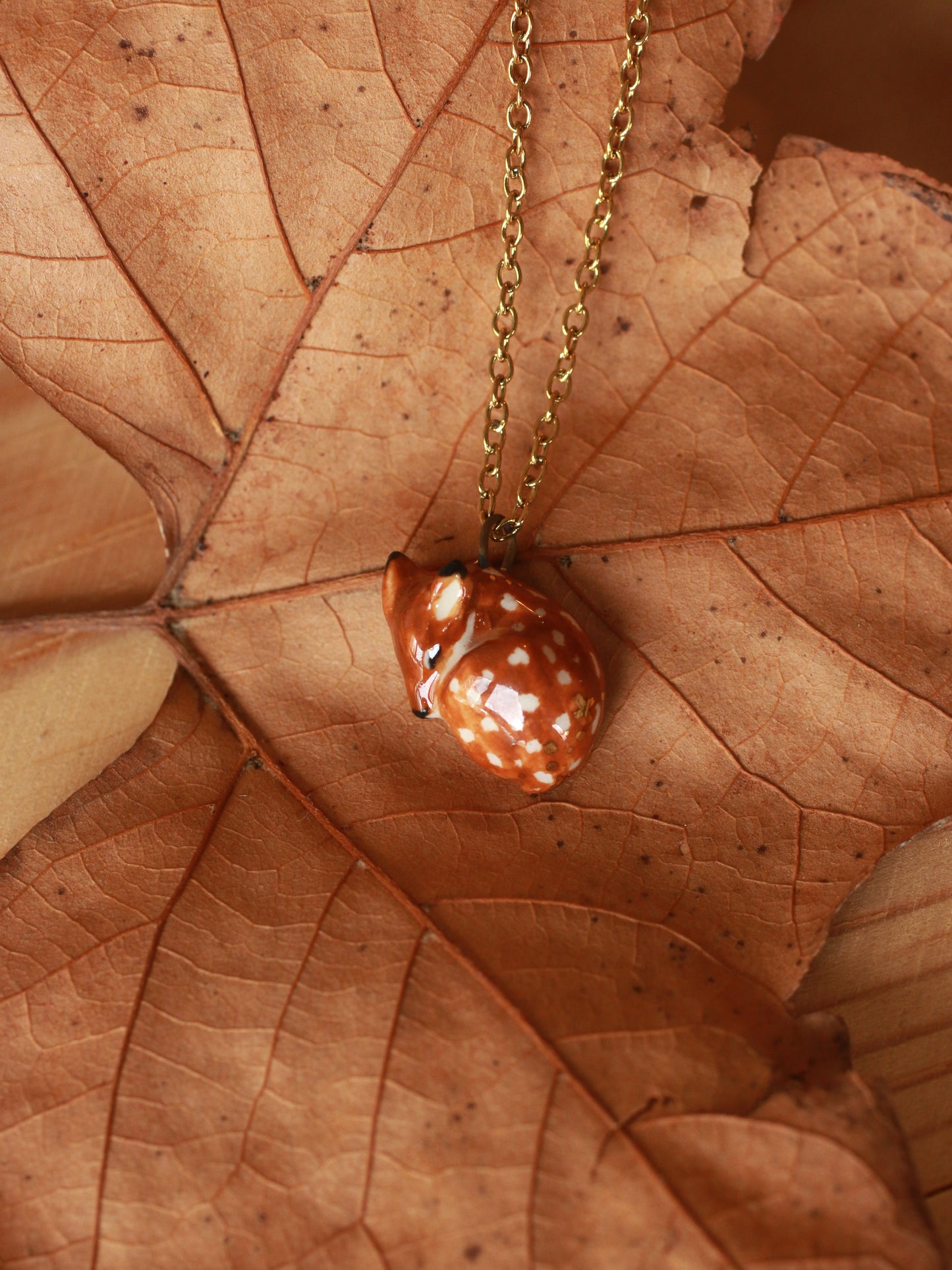 Sleeping Fawn necklace in a walnut box