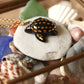 Ceramic black sea turtle necklace -  with 22k gold details