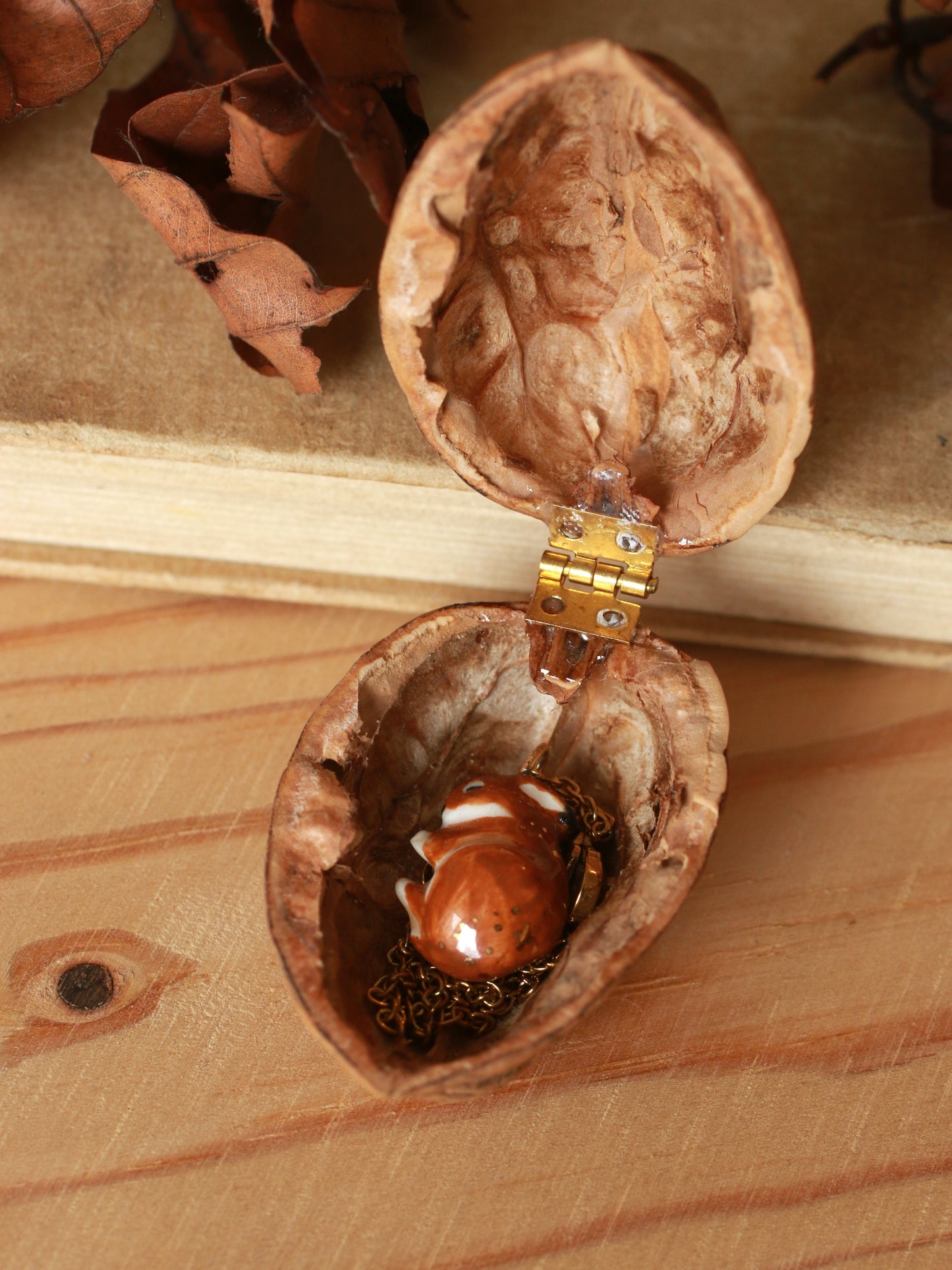 Sleeping bunny necklace in a walnut box