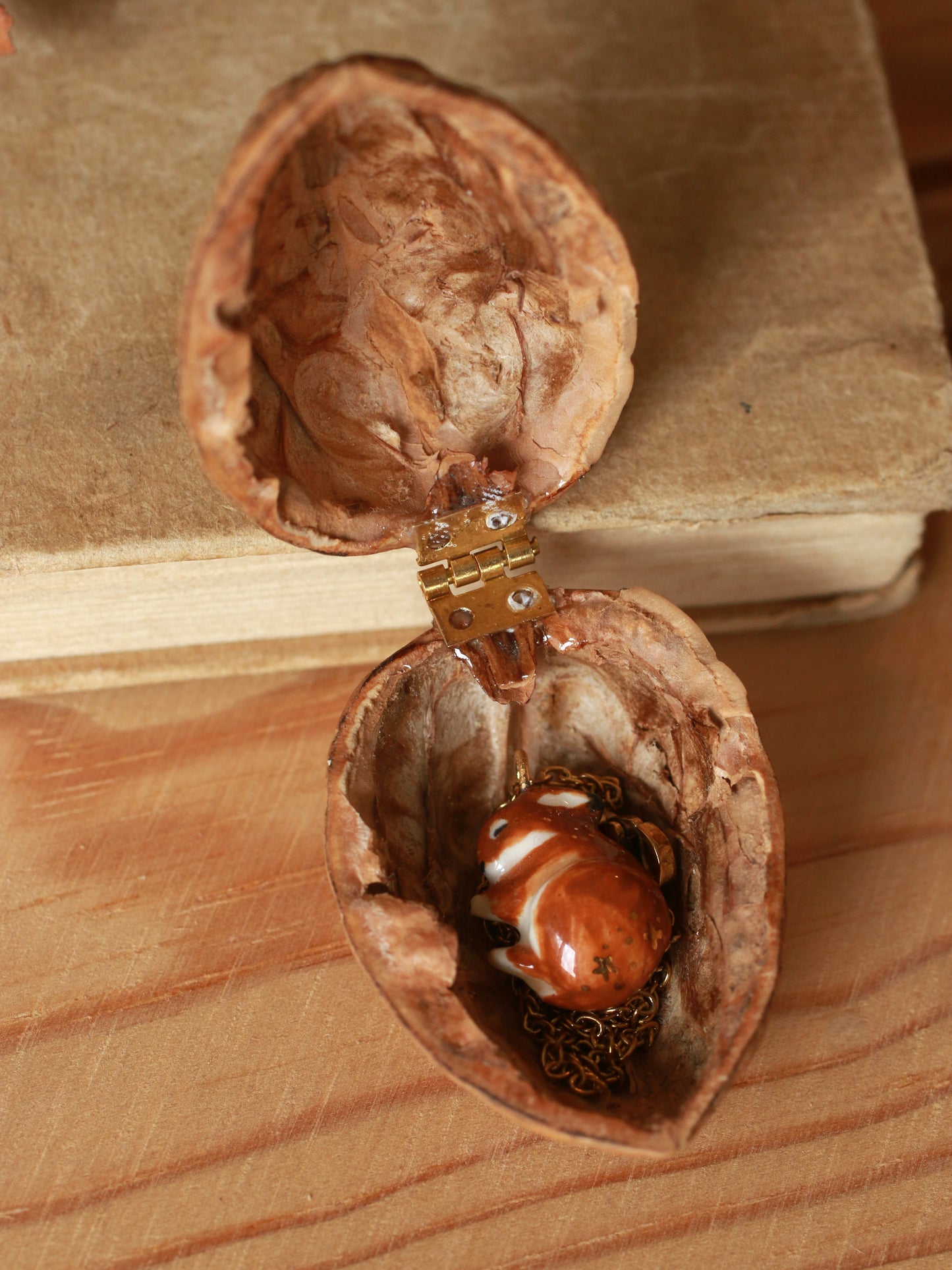 Sleeping bunny necklace in a walnut box