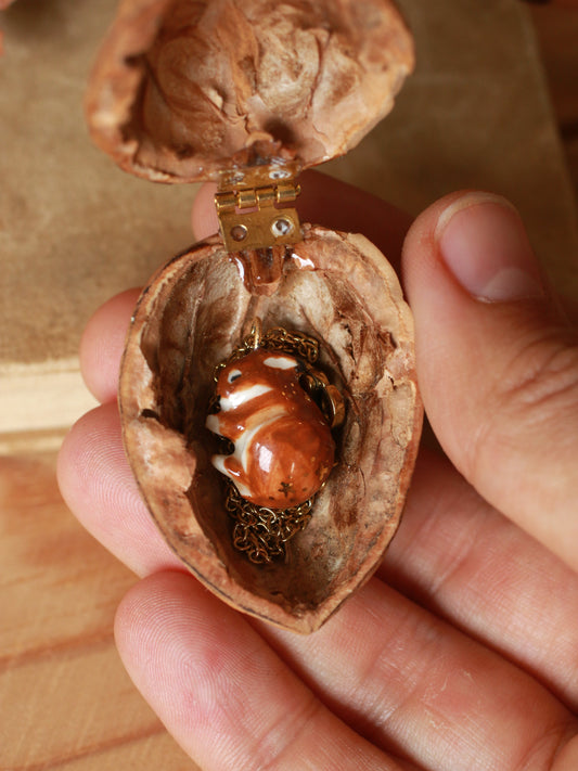 Sleeping bunny necklace in a walnut box