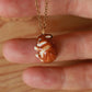 Sleeping bunny necklace in a walnut box