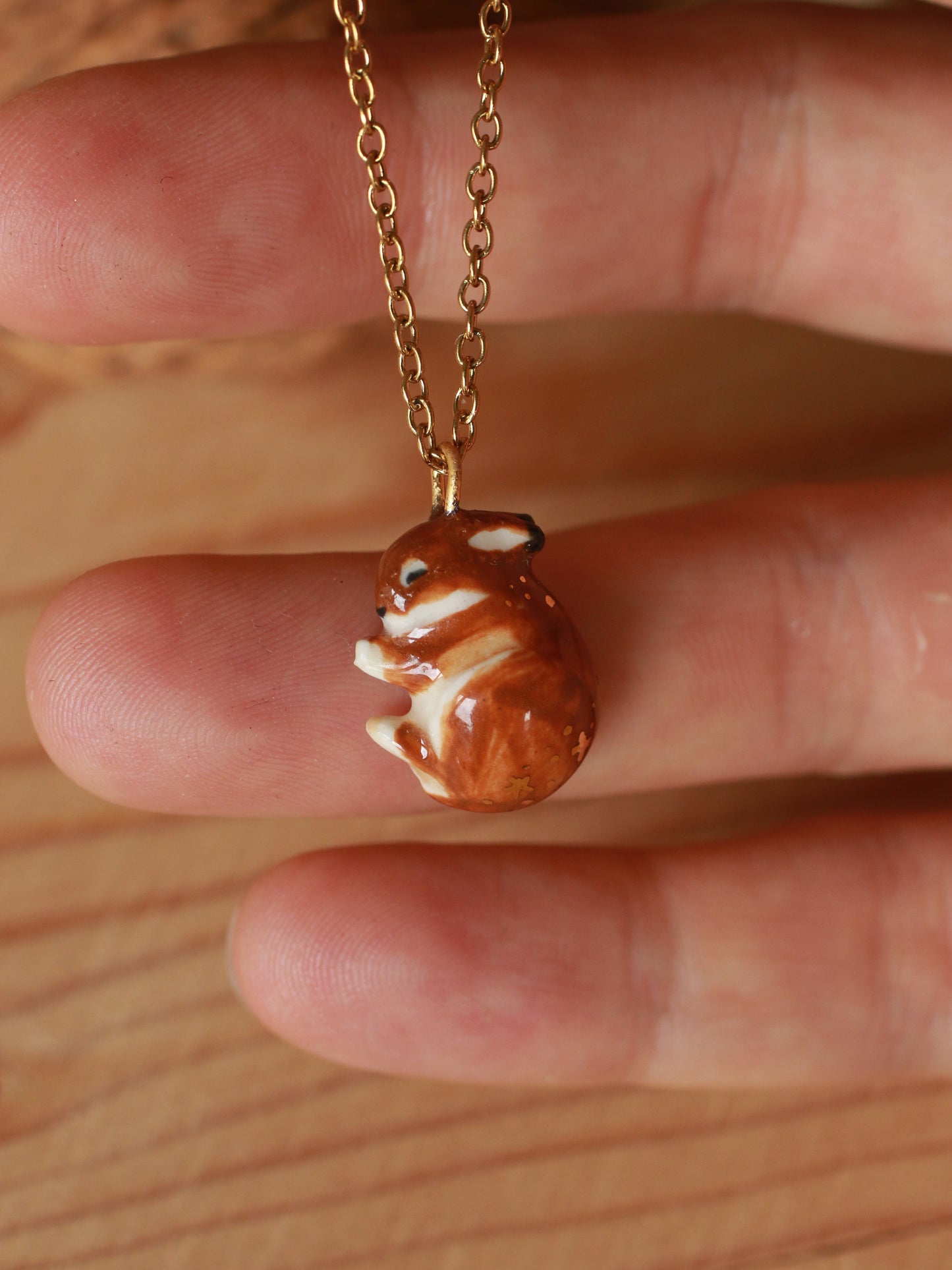 Sleeping bunny necklace in a walnut box