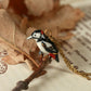 Woodpecker necklace