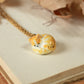 Sleeping orange tabby cat necklace