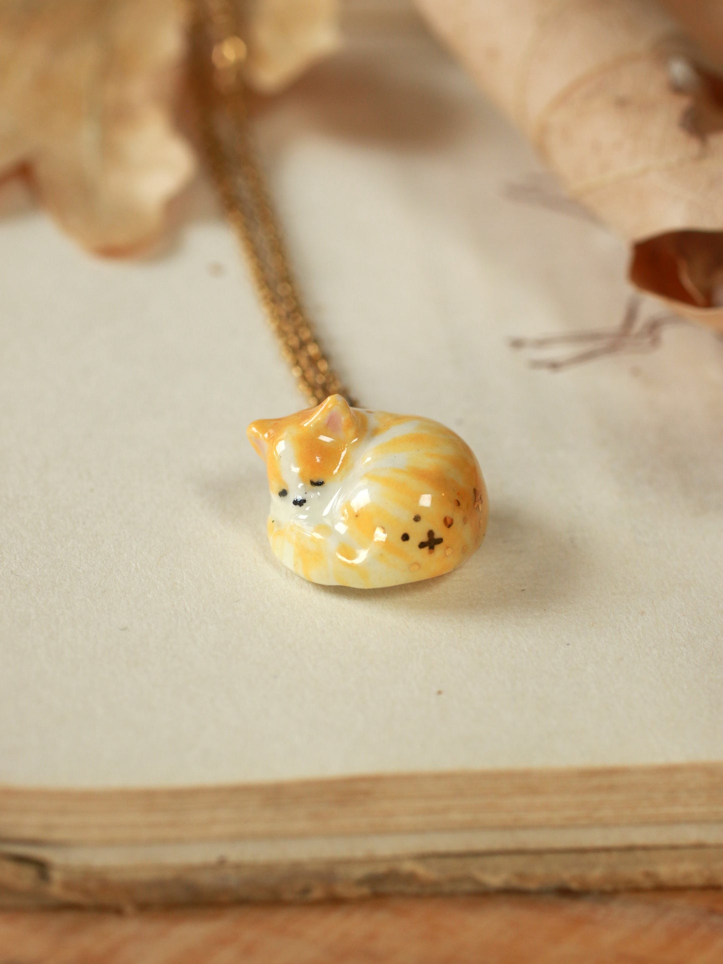 Sleeping orange tabby cat necklace