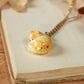 Sleeping orange tabby cat necklace