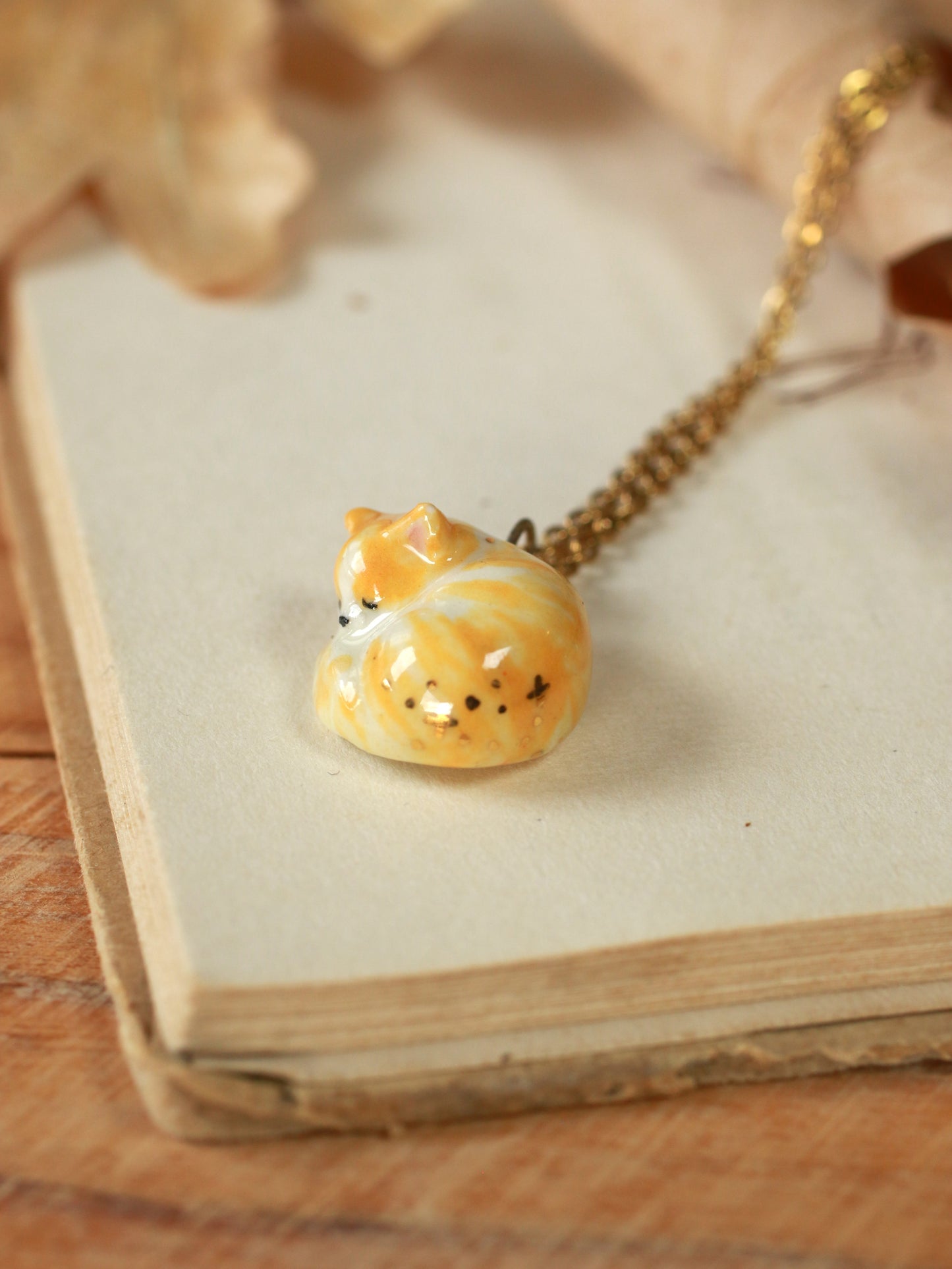 Sleeping orange tabby cat necklace