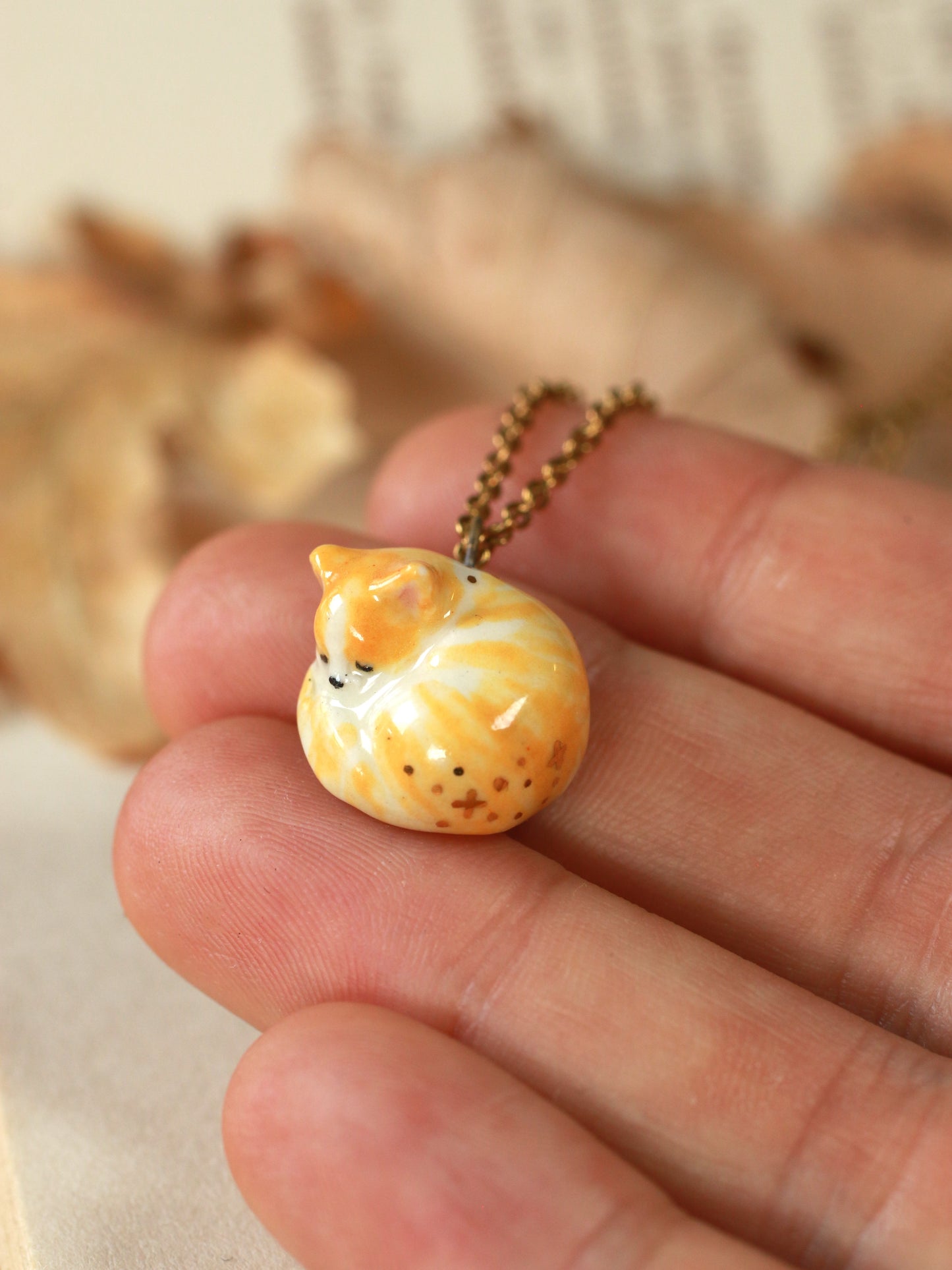 Sleeping orange tabby cat necklace
