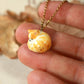 Sleeping orange tabby cat necklace