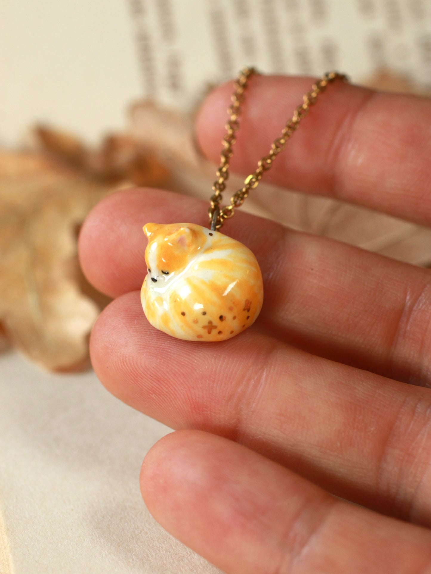 Sleeping orange tabby cat necklace