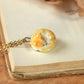 Sleeping orange tabby cat necklace