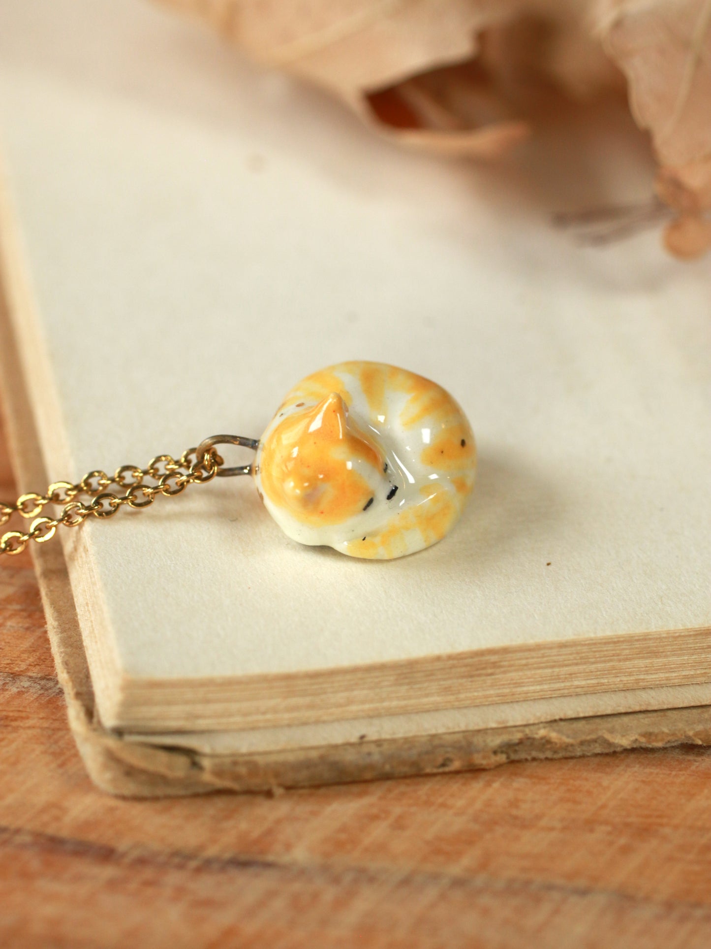 Sleeping orange tabby cat necklace