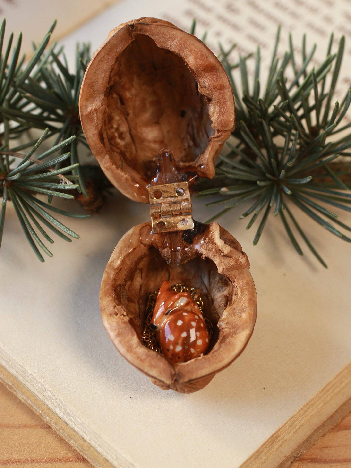 Sleeping Fawn necklace in a walnut box