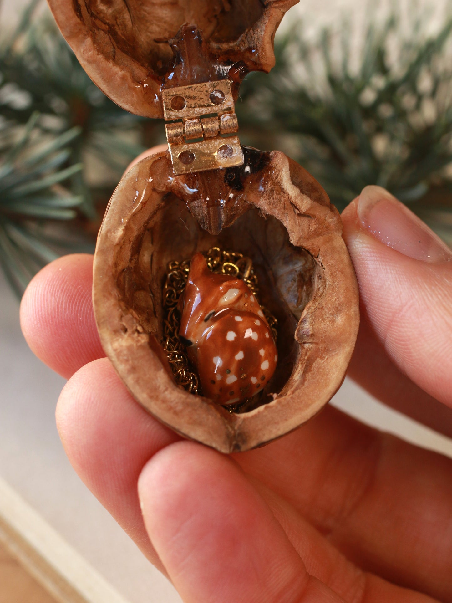 Sleeping Fawn necklace in a walnut box