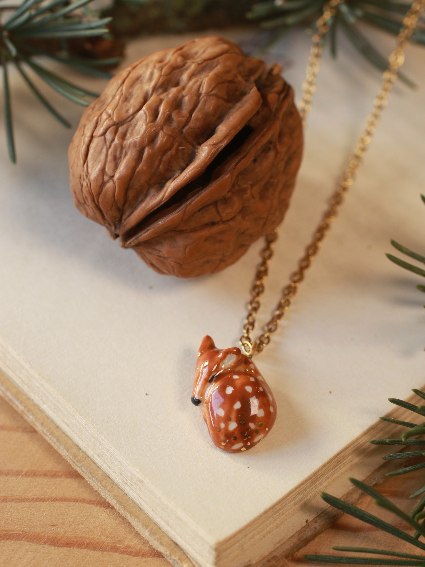 Sleeping Fawn necklace in a walnut box