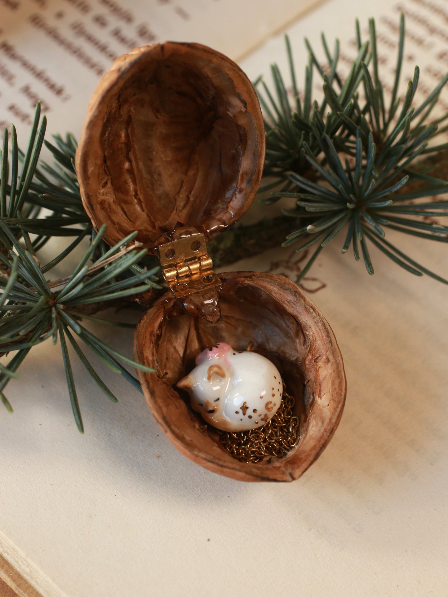 Sleeping cat necklace in a walnut box