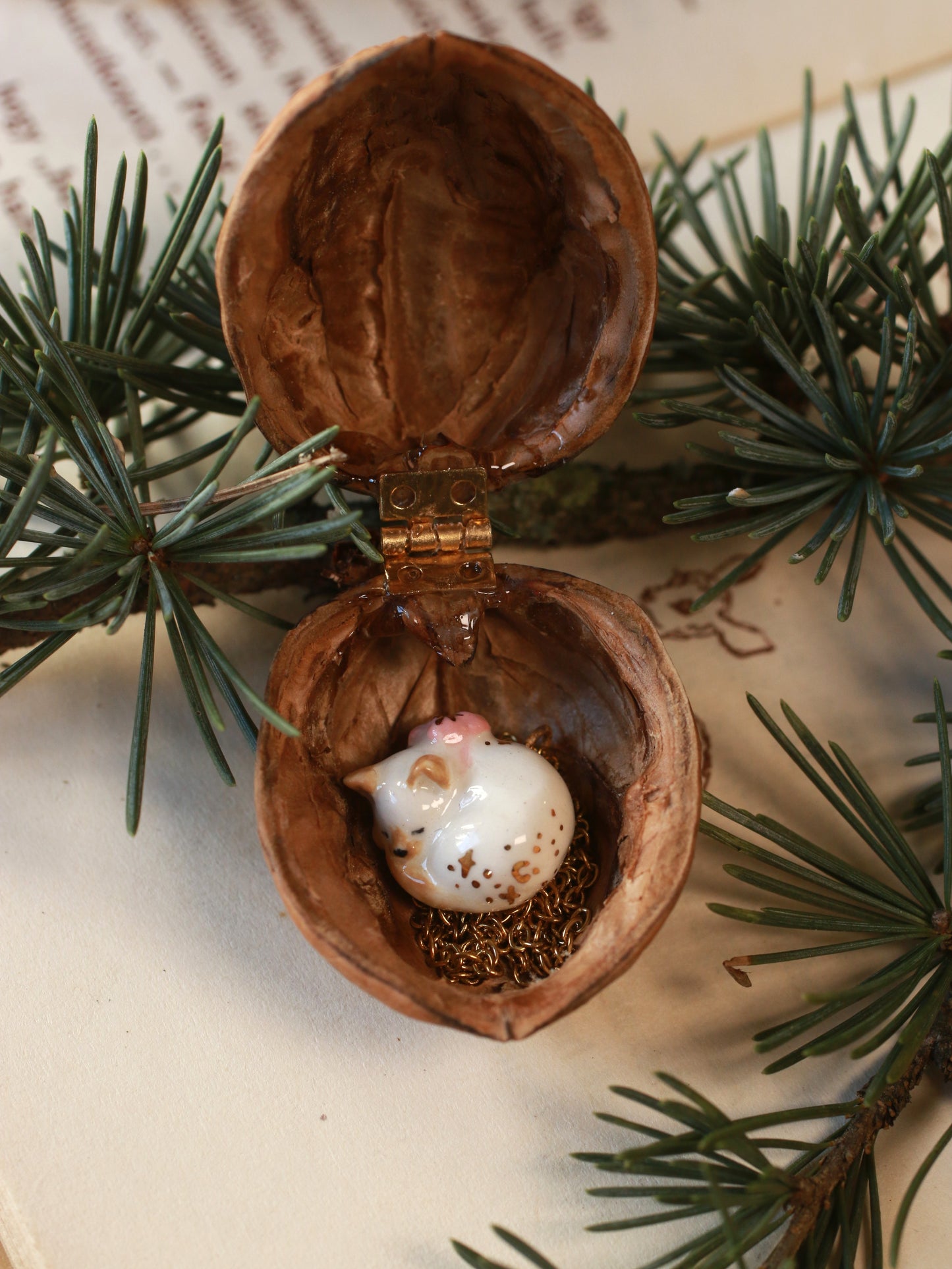 Sleeping cat necklace in a walnut box