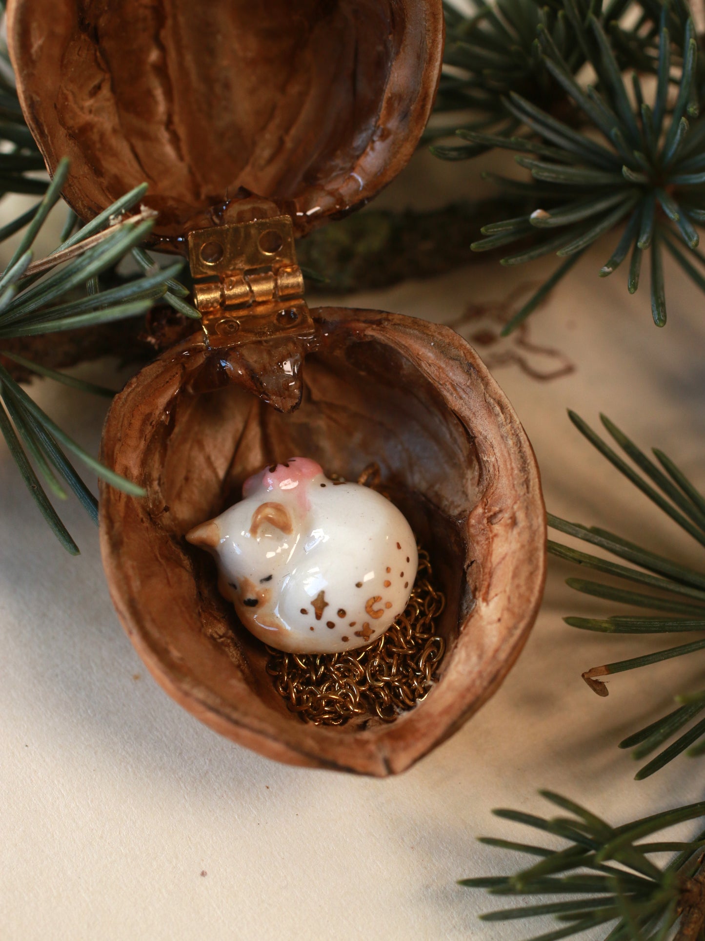 Sleeping cat necklace in a walnut box