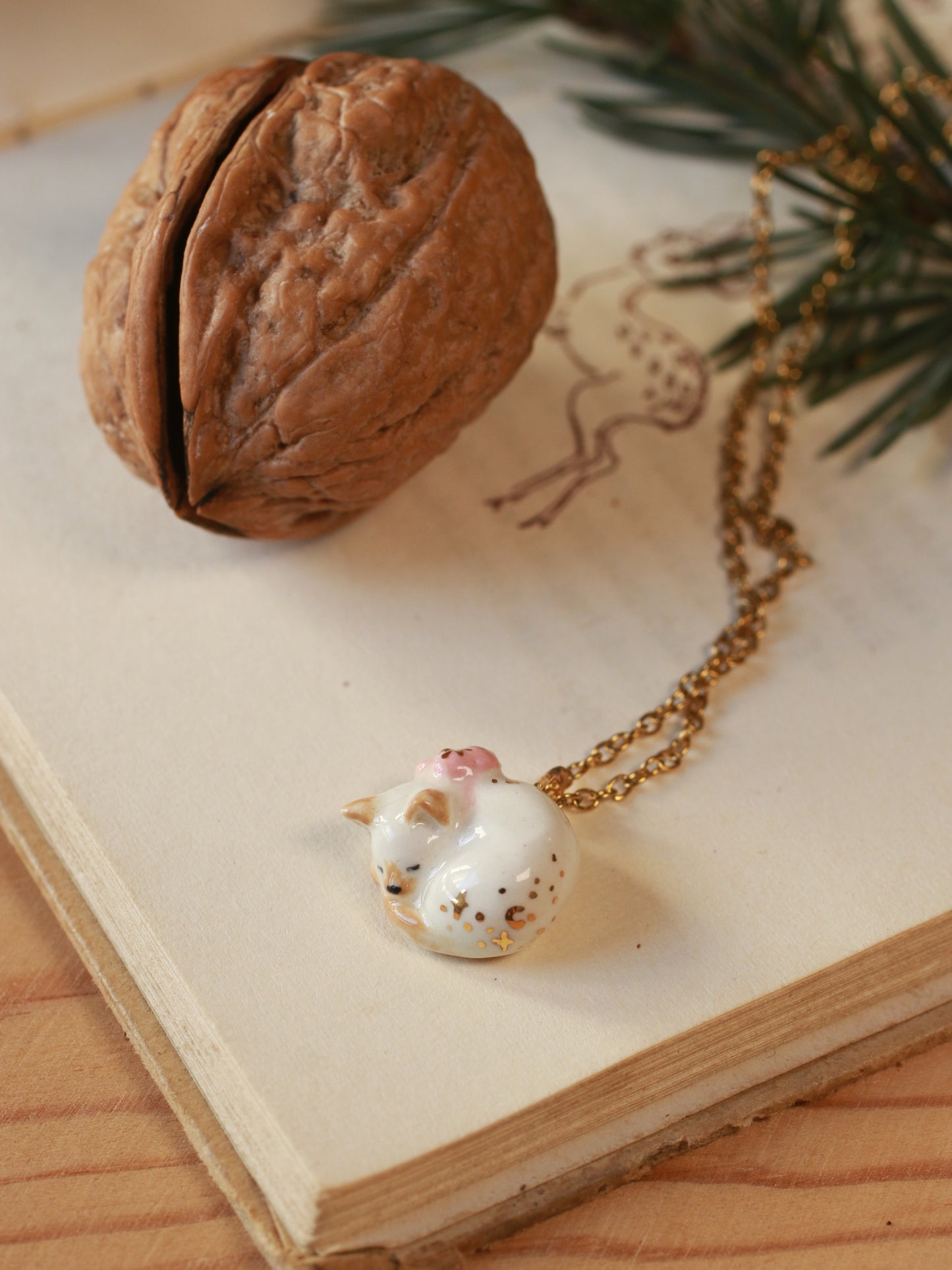 Sleeping cat necklace in a walnut box
