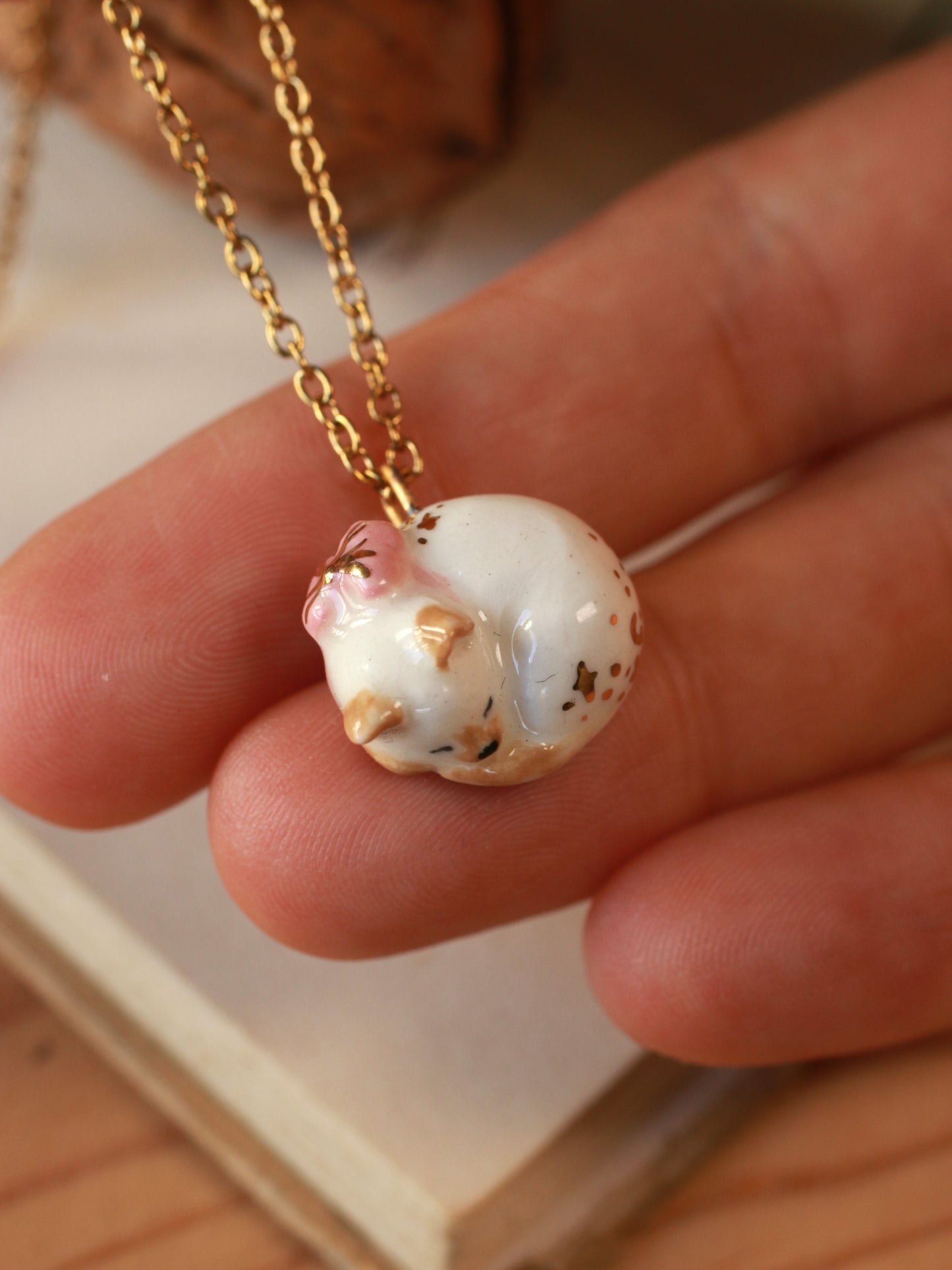 Sleeping cat necklace in a walnut box