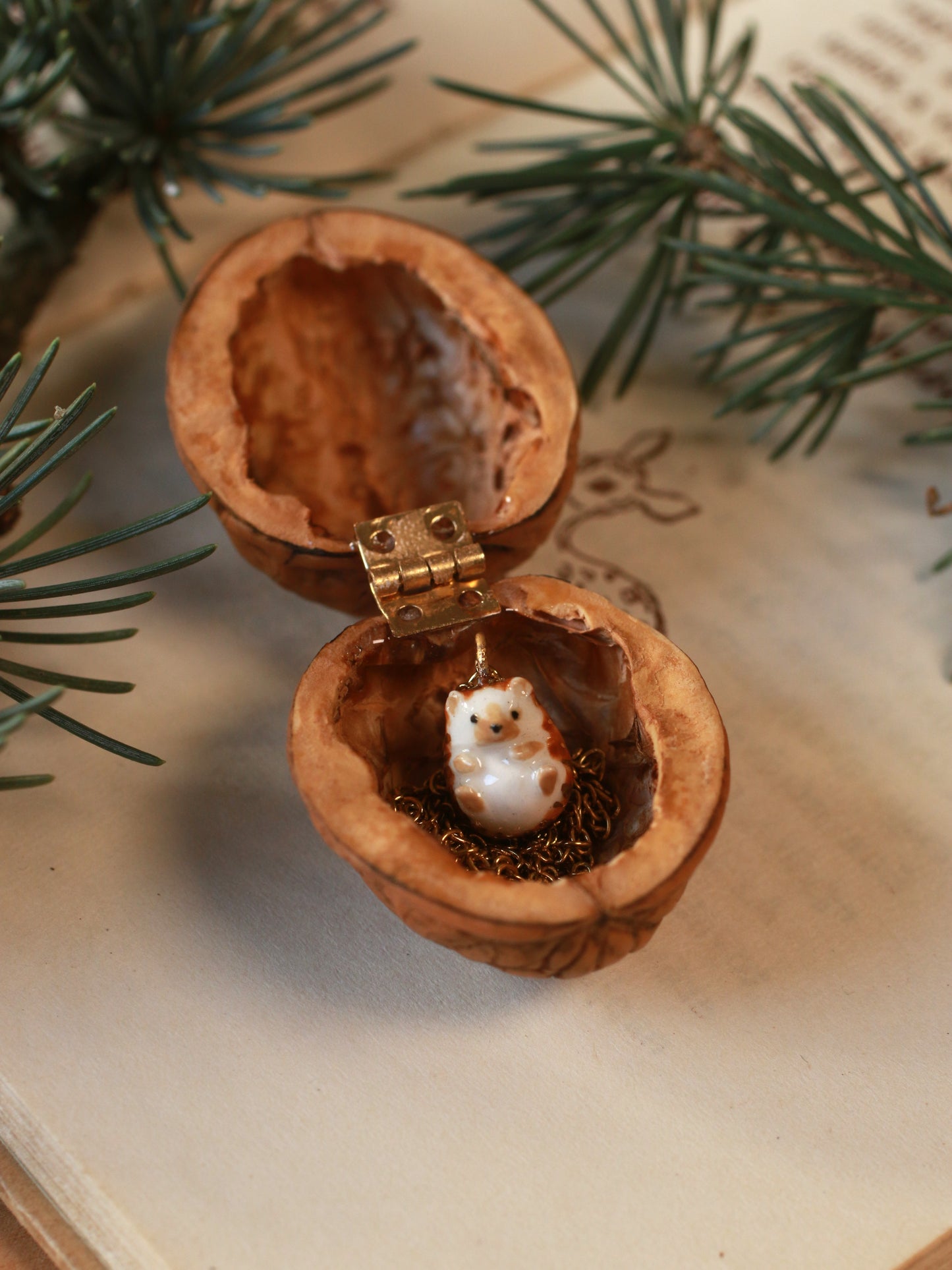 Hedgehog necklace in a walnut box
