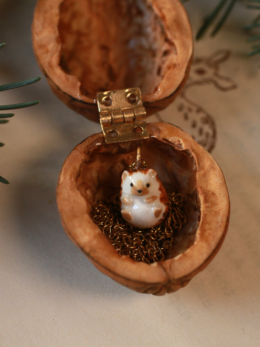 Hedgehog necklace in a walnut box