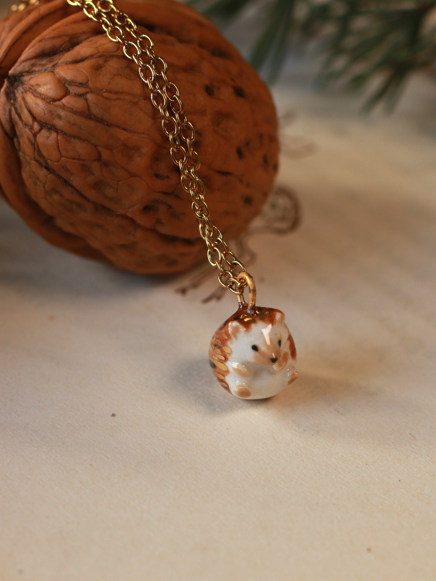Hedgehog necklace in a walnut box