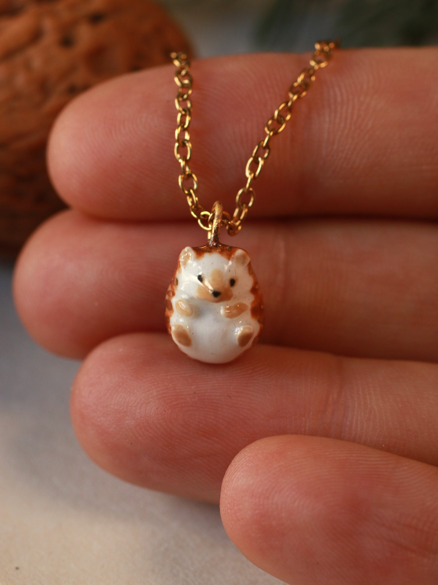 Hedgehog necklace in a walnut box